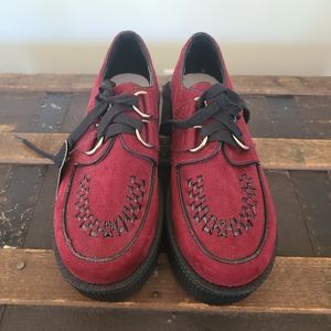 Red suede platform shoes